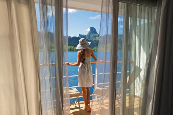Paul Gauguin Cruises MS Paul Gauguin Woman on Balcony ©Paul Gauguin Cruises.jpg